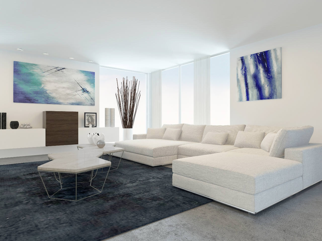 Modern living room with a large white sectional sofa, dark rug, minimalist coffee table, abstract artwork on white walls, and tall decorative branches in a vase near large floor-to-ceiling windows.