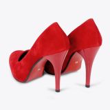 A pair of red high-heeled shoes with a suede finish, shown from the back and side on a white background.