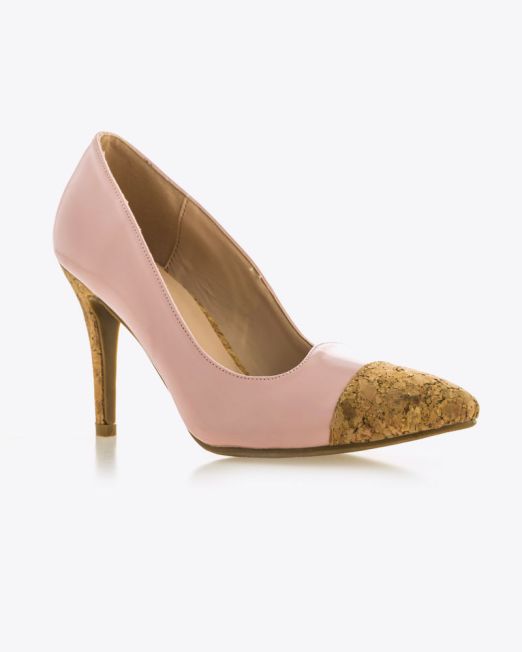 A pink high-heeled shoe with a pointed cork-textured toe and a matching cork-textured stiletto heel, displayed on a white background.