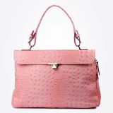 A pink crocodile-textured handbag with a top handle, flap closure, and silver-tone clasp, displayed against a plain white background.