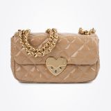 Beige quilted handbag with gold chain straps and a gold heart-shaped clasp on the front, set against a plain white background.