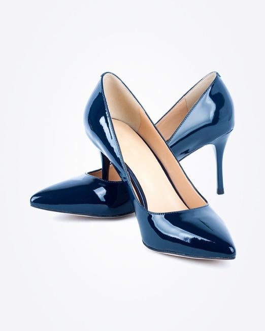 A pair of shiny navy blue high-heeled pumps with pointed toes, arranged stylishly against a white background.