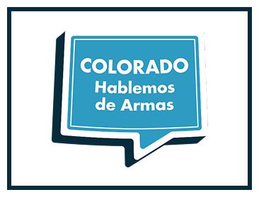 A blue speech bubble with white text reads Colorado Hablemos de Armas, meaning Colorado Lets Talk About Guns in Spanish. The bubble is outlined in dark blue and has a white border.